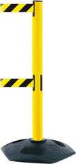 Tensator - 38" High, 2-1/2" Pole Diam, 4 Way Stanchion - 19" Base Diam, Octagon Recycled Rubber Base, Yellow Plastic Post, 7-1/2' x 2" Tape, Dual Line Tape, For Outdoor Use - All Tool & Supply