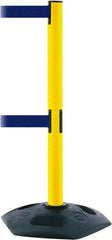 Tensator - 38" High, 2-1/2" Pole Diam, 4 Way Stanchion - 19" Base Diam, Octagon Recycled Rubber Base, Yellow Plastic Post, 7-1/2' x 2" Tape, Dual Line Tape, For Outdoor Use - All Tool & Supply