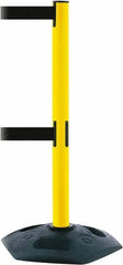 Tensator - 38" High, 2-1/2" Pole Diam, 4 Way Stanchion - 19" Base Diam, Octagon Recycled Rubber Base, Yellow Plastic Post, 7-1/2' x 2" Tape, Dual Line Tape, For Outdoor Use - All Tool & Supply