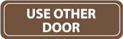 NMC - Use Other Door, 11" Wide x 3.5" High, Acrylic Sign - English, White on Brown, Wall Mount - All Tool & Supply